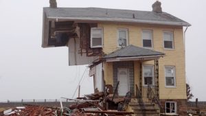 Yellow two story home partially demolished after Superstorm Sandy, Union Beach, NJ. Photo by Clinton J. Andrews